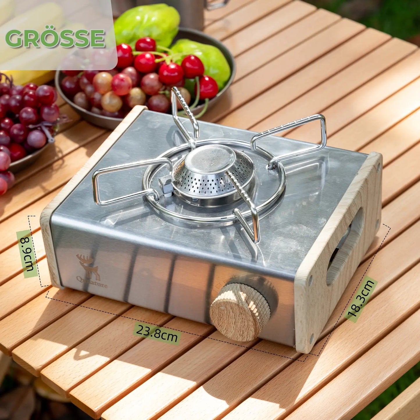 gas stove with dimension labels on a wooden camping table