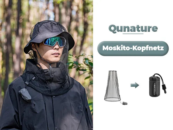 mann im wald mit moskitonetz und hut