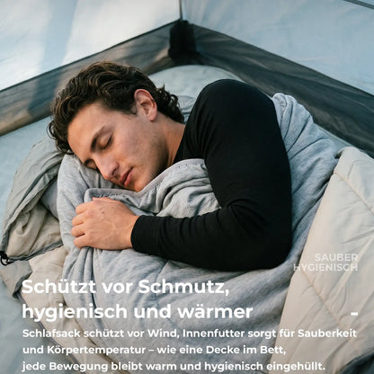 mann eingewickelt in stoffeinlage beim camping