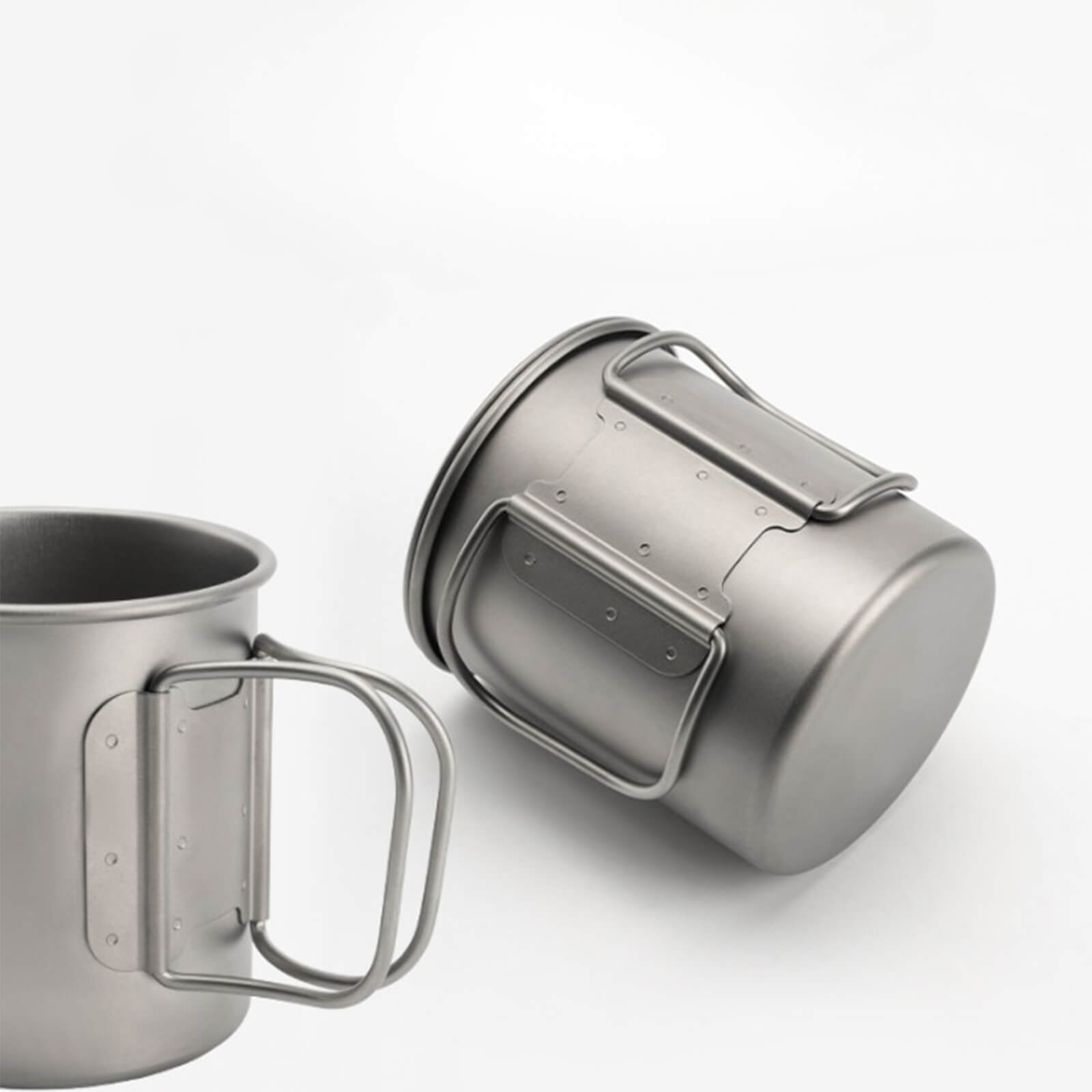 titan camping cup with foldable handle shown in upright and collapsed states, studio shot on white background