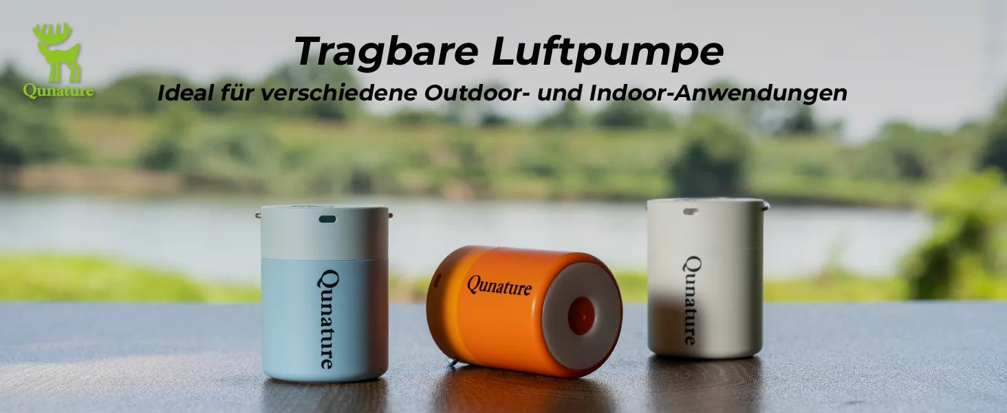 drei tragbare elektrische luftpumpen in blau orange weiß am see