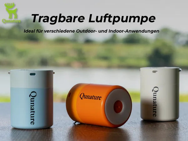 drei tragbare elektrische luftpumpen in blau orange weiß am see