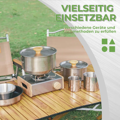 wiping the stainless steel gas stove surface with a blue cloth for cleaning